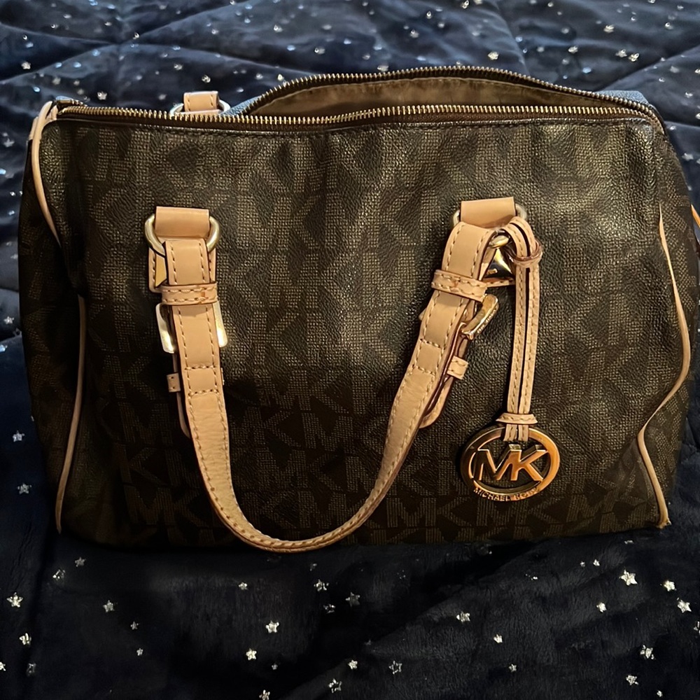 Michael Kors Tote bag. Has minor tear and wear . Clean inside